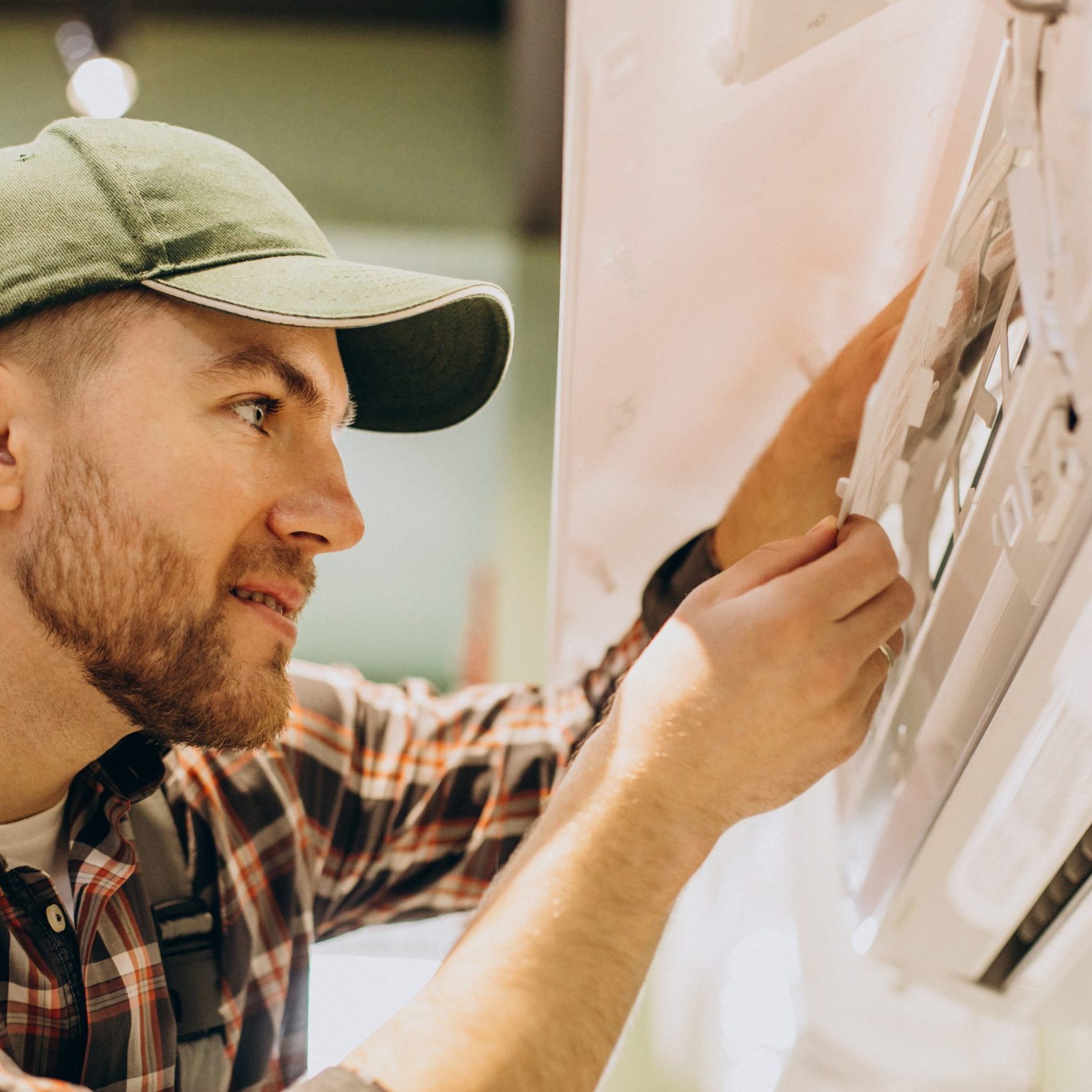 Repairman doing air conditioner servise